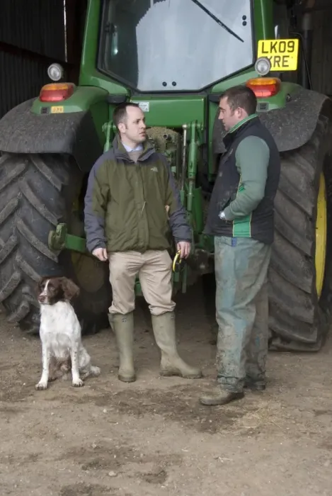 Framed Print : Agronomist discussing program for day with farmer, standing beside tractor, Hertfordshire, England, april Framed Print : Agronomist discussing program for day with farmer, standing beside tractor, Hertfordshire, England, april