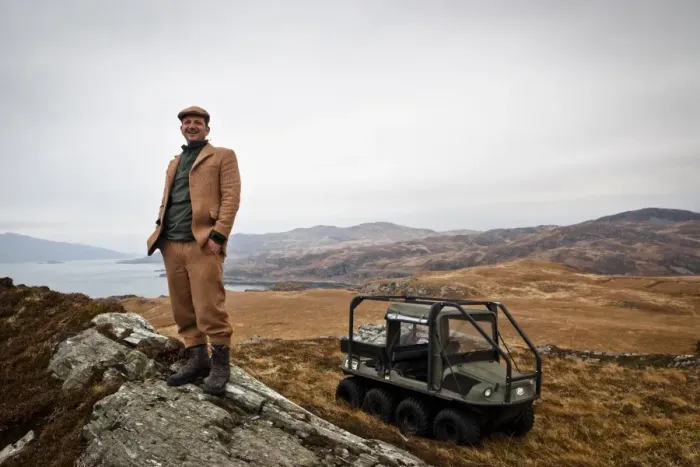 Framed Print : Andrew Fletcher, owner of Adrlussa Estate, standing near Argo 8x8 amphibious all-terrain vehicle on moorland Framed Print : Andrew Fletcher, owner of Adrlussa Estate, standing near Argo 8x8 amphibious all-terrain vehicle on moorland