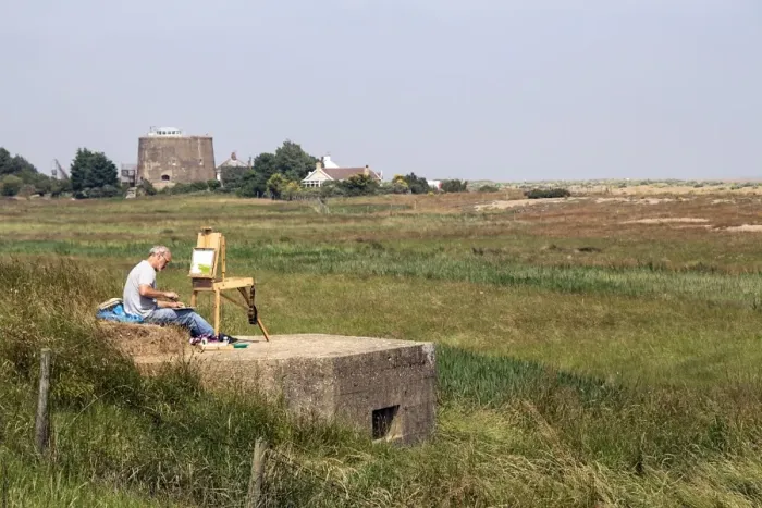 Framed Print : Artist sitting on World War 2 pill box looking over Oxley marsh at Shingle Street, Suffolk Framed Print : Artist sitting on World War 2 pill box looking over Oxley marsh at Shingle Street, Suffolk