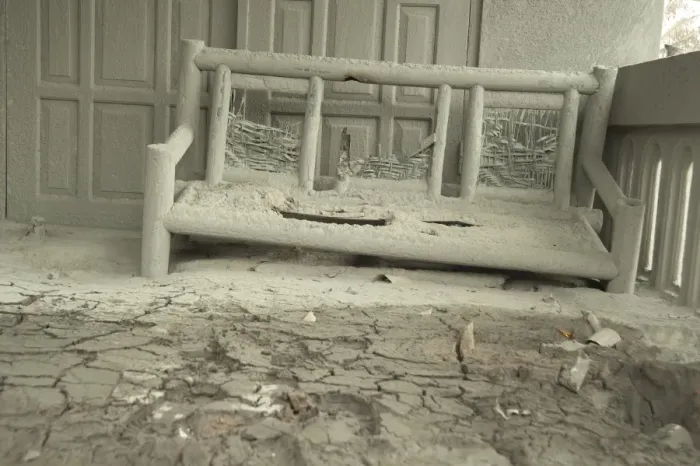 Framed Print : Ash covered seat outside house damaged from recent volcanic eruption, Kepuharjo, Mount Merapi, Central Java, Indonesia