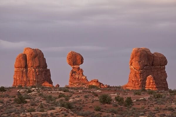 Balanced Rock in the glow of evening light is a defiant 55-foot tall block of Estrada Sandstone that rests on a narrow