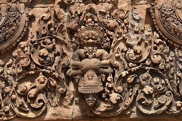 Bas-relief in Khmer Hindu temple depicting Vishnu ripping chest of King Hiranyakasipu, Banteay Srei, Angkor, Siem Riep