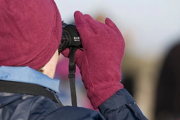 Birdwatchers with binoculars, Titchwell RSPB Reserve, Norfolk, England, december
