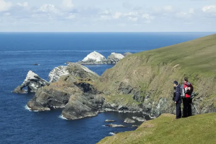 Framed Print : Birdwatchers overlooking seabird nesting colony on cliffs, Hermaness National Nature Reserve, Unst, Shetland Islands Framed Print : Birdwatchers overlooking seabird nesting colony on cliffs, Hermaness National Nature Reserve, Unst, Shetland Islands
