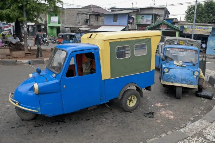 Framed Print : Blue tuk tuk three-wheeler vans on road in city, Manggarai District, Jakarta, Java, Indonesia, December Framed Print : Blue tuk tuk three-wheeler vans on road in city, Manggarai District, Jakarta, Java, Indonesia, December