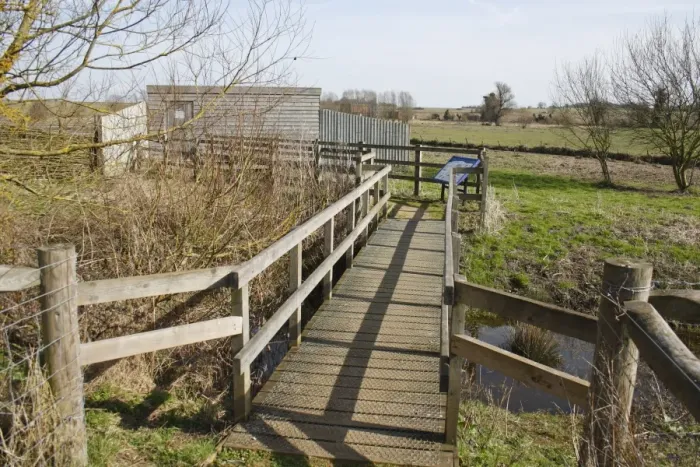 Framed Print : Boardwalk and hide overlooking grazing marsh habitat, River Black Bourn, Micklemere Nature Reserve, Pakenham, Suffolk, England, march