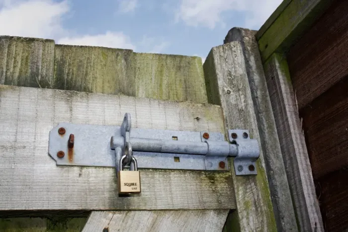 Framed Print : Bolt and padlock on garden gate, Mendlesham, Suffolk, England, February