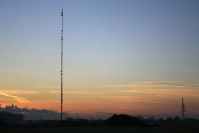 Framed Print : Broadcasting and telecommunication facility with guyed steel lattice mast silhouetted at sunset, Mendlesham Mast, Mendlesham Transmitting Station, Mendlesham, Suffolk, England, november Framed Print : Broadcasting and telecommunication facility with guyed steel lattice mast silhouetted at sunset, Mendlesham Mast, Mendlesham Transmitting Station, Mendlesham, Suffolk, England, november