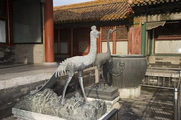 Bronze phoenix and crane statues in courtyard of imperial palace, Forbidden City, Beijing, China, september