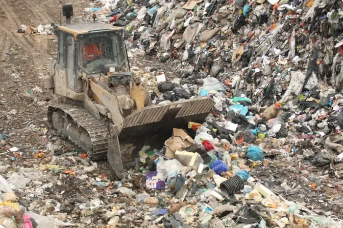 Framed Print : Bulldozer moving rubbish on landfill tip, Dorset, England, February Framed Print : Bulldozer moving rubbish on landfill tip, Dorset, England, February