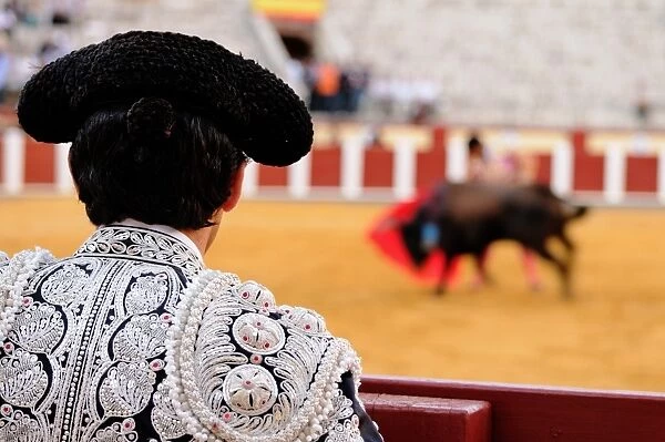 Bullfighting, Matador assisting final stage from border of bullring, Tercio de muerte stage of bullfight, Spain