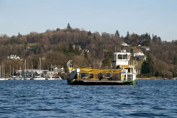 Car ferry travelling across lake, Lake Windermere, Lake District N. P. Cumbria, England, February