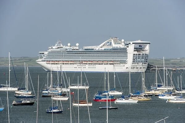 Caribbean Princess cruise ship at harbour, with yachts in foreground, Holyhead, Holy Island, Anglesey, Wales, August