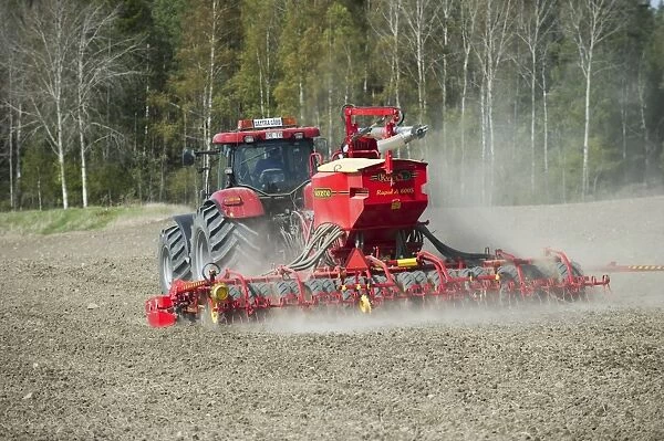 Case 225 CVX tractor with Vaderstad Rapid A 600S seed drill, drilling arable field, Upplands Vasby, Sweden, may