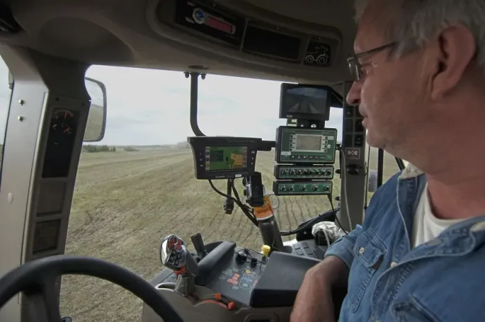 Framed Print : Case 225 tractor interior and farmer, with GPS and Samson vacuum slurry tanker control panel