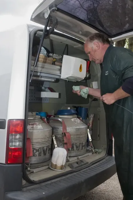 Framed Print : Cattle farming, artificial insemination technician preparing semen for cow in back of van, England, May Framed Print : Cattle farming, artificial insemination technician preparing semen for cow in back of van, England, May