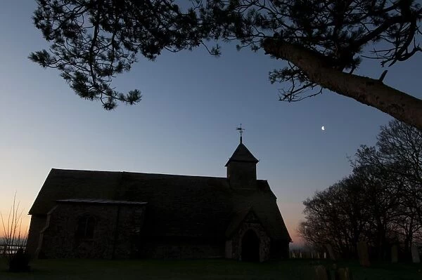 Church silhouetted at dawn, Harty Church, Harty, Isle of Sheppey, Kent, England, january
