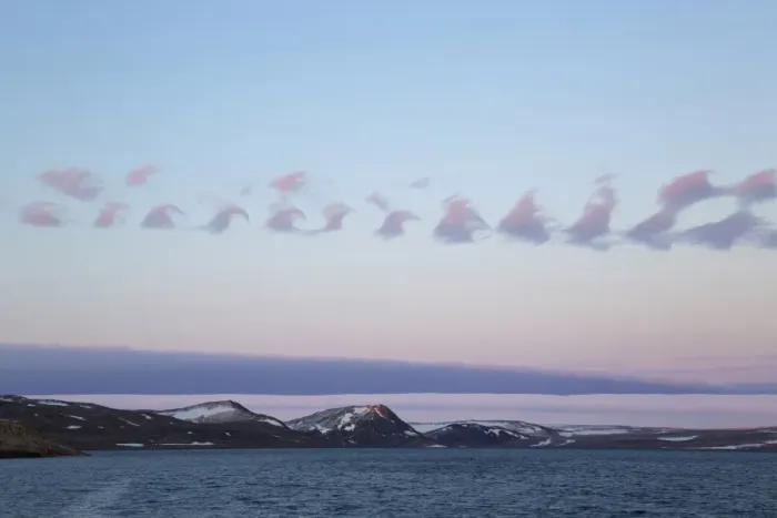Framed Print : Cirrus Kelvin-Helmholtz wave cloud formation over coastline at dusk, Hinlopenstretet, Spitsbergen, Svalbard, August