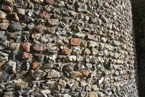 Close-up of flint walls of Norman round-tower, largest Norman round-tower in country, St