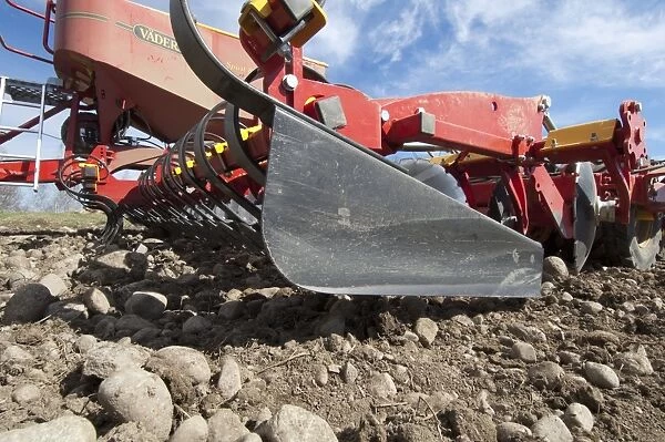Close-up of Vaderstad Spirit 800S cultivator drill, in arable field with stony soil, Sweden, may