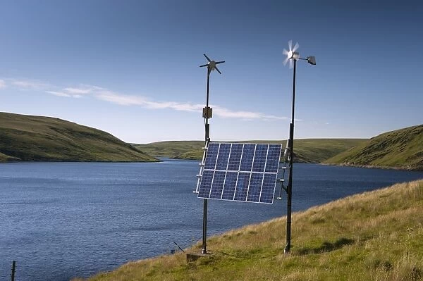 Combination of solar panels and wind turbines, harnessing renewable energy to produce electricity at remote reservoir