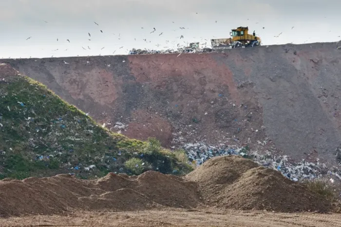 Framed Print : Compaction machines working on council rubbish tip, near Ellesmere, Cheshire, England, march Framed Print : Compaction machines working on council rubbish tip, near Ellesmere, Cheshire, England, march