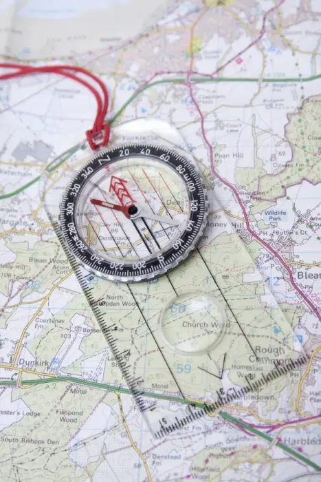 Framed Print : Compass on Ordnance Survey map of Kent, England, August Framed Print : Compass on Ordnance Survey map of Kent, England, August