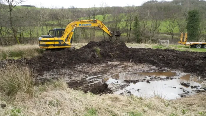 Framed Print : Contractor with 360degree excavator, digging wildlife pond on farm, Powys, Wales, April Framed Print : Contractor with 360degree excavator, digging wildlife pond on farm, Powys, Wales, April