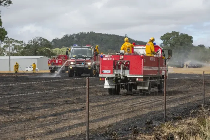 Framed Print : Country Fire Authority firemen putting out grass fire, Langley, Victoria, Australia, February