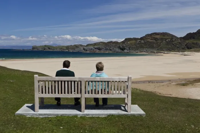 Framed Print : Couple sitting on bench overlooking coastline with sandy beach, Kiloran Bay, Isle of Colonsay, Inner Hebrides, Scotland Framed Print : Couple sitting on bench overlooking coastline with sandy beach, Kiloran Bay, Isle of Colonsay, Inner Hebrides, Scotland