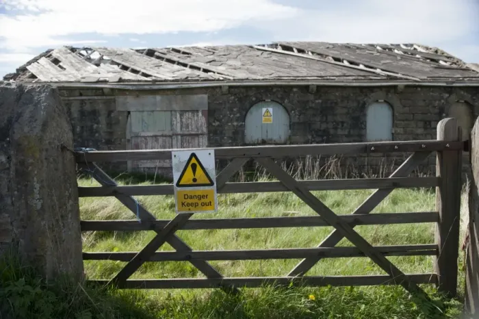 Framed Print : Danger, Keep out sign on gate and derelict farm building, Lancashire, England, April Framed Print : Danger, Keep out sign on gate and derelict farm building, Lancashire, England, April