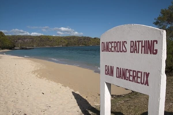 Dangerous Bathing, Bain Dangereux bilingual sign on sandy beach, Southwest Mauritius