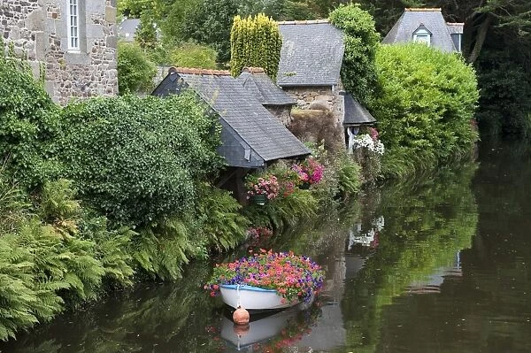 Decorative floral boat in river, Pontrieux, Cotes-d Armor, Brittany, France, September