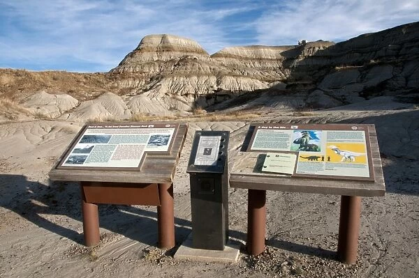 Dinosaur information boards in badlands habitat, Dinosaur Provincial Park, Alberta, Canada, october