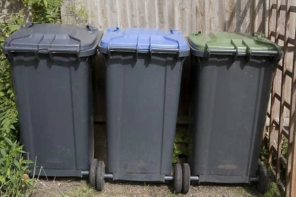 Domestic rubbish bins dividing general, recycling and garden refuse, England, June