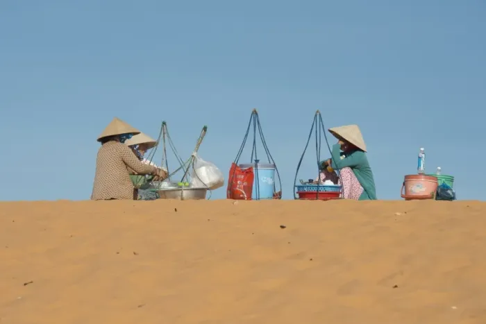 Framed Print : Drink sellers in conical hats, sitting on coastal sand dunes, Phan Thiet, Binh Thuan Province, Vietnam, December Framed Print : Drink sellers in conical hats, sitting on coastal sand dunes, Phan Thiet, Binh Thuan Province, Vietnam, December