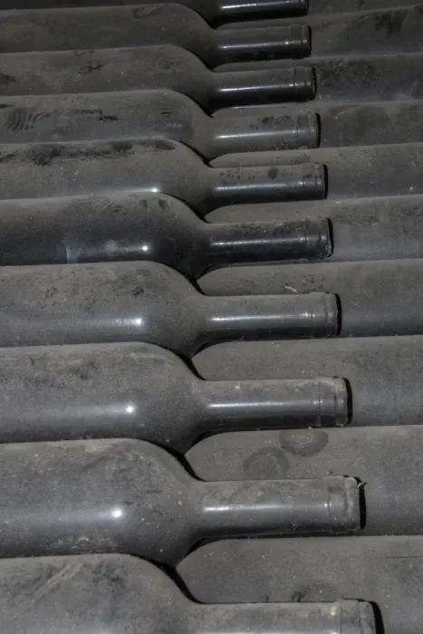 Framed Print : Dust covered old bottles of wine. Guasti Clemente of Nizza Northan Italy
