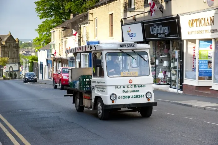 Framed Print : Electric milk float delivering in town, Clitheroe, Lancashire, England, may Framed Print : Electric milk float delivering in town, Clitheroe, Lancashire, England, may