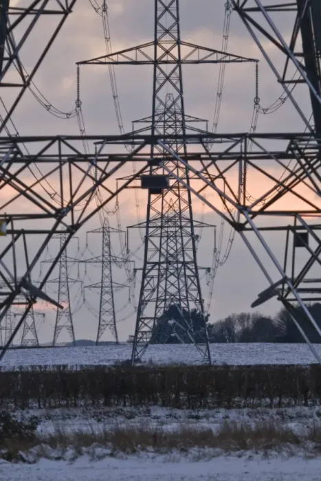 Framed Print : Electricity transmission pylons and overhead wires, crossing over snow covered farmland at sunset, Dorset, England, december Framed Print : Electricity transmission pylons and overhead wires, crossing over snow covered farmland at sunset, Dorset, England, december