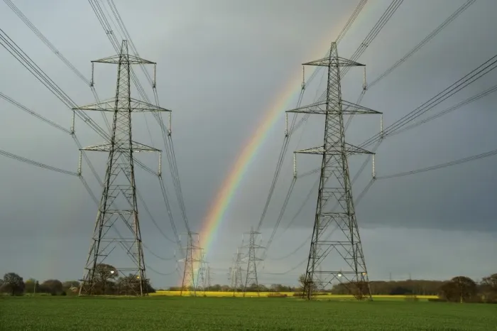 Framed Print : Electricity transmission pylons and rainbow, with flowering oilseed rape field in distance, near Aldeburgh, Suffolk Framed Print : Electricity transmission pylons and rainbow, with flowering oilseed rape field in distance, near Aldeburgh, Suffolk