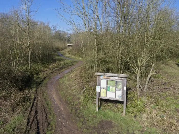Framed Print : Entrance sign and track in woodland habitat, Highnam Woods RSPB Reserve, Gloucestershire, England, March Framed Print : Entrance sign and track in woodland habitat, Highnam Woods RSPB Reserve, Gloucestershire, England, March