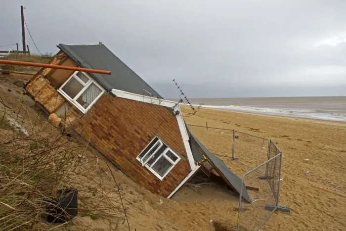 Framed Print : Eroded sea cliffs and damaged chalet after December 2013 tidal surge, Hemsby, Norfolk, England, January Framed Print : Eroded sea cliffs and damaged chalet after December 2013 tidal surge, Hemsby, Norfolk, England, January
