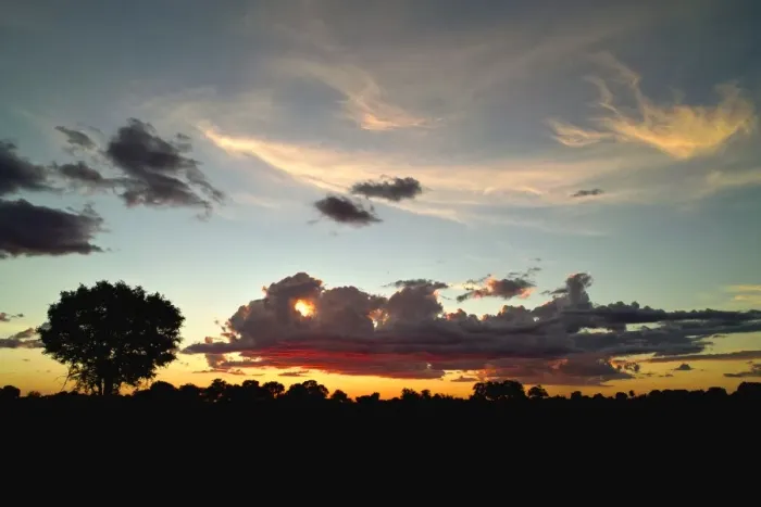 Framed Print : Evening sky in the Okavango Delta, the sun sets behind cumulus clouds with some cirrus clouds high in the sky Framed Print : Evening sky in the Okavango Delta, the sun sets behind cumulus clouds with some cirrus clouds high in the sky