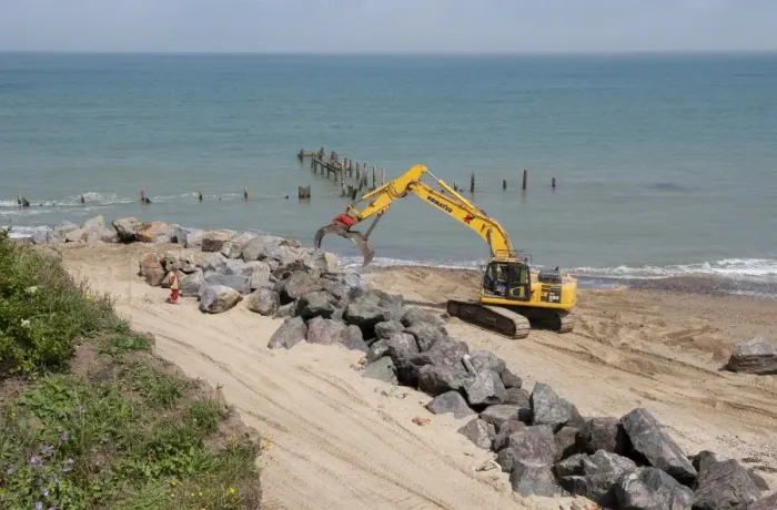 Framed Print : Excavator on beach, repairing sea defences with boulders, Happisburgh, Norfolk, England, august Framed Print : Excavator on beach, repairing sea defences with boulders, Happisburgh, Norfolk, England, august