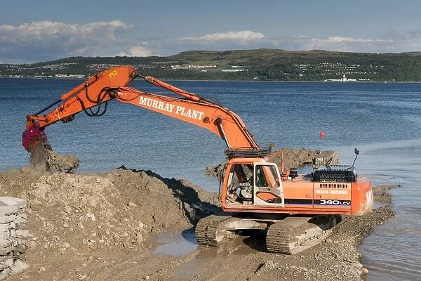 Excavator building sea defences, Dunoon, Firth of Clyde, Argyll and Bute, Scotland, august