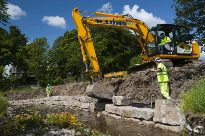 Framed Print : Excavator improving stream bank to help prevent flooding, Cumbria, England, june