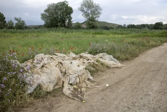 Framed Print : Farm rubbish, plastic cover crop waste, left at field edge Framed Print : Farm rubbish, plastic cover crop waste, left at field edge