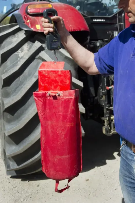 Framed Print : Farmer checking how much to sow on Vaderstad Rapid A 600S seed drill, Upplands Vasby, Sweden, may