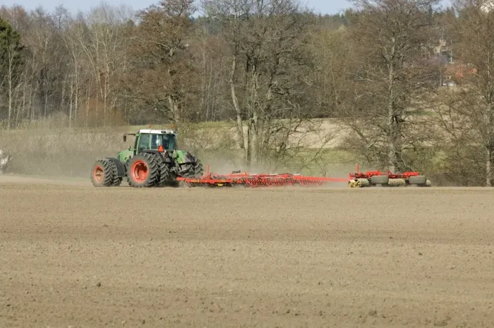 Framed Print : Fendt tractor pulling harrows and rollers, harrowing and rolling field, Sweden, spring