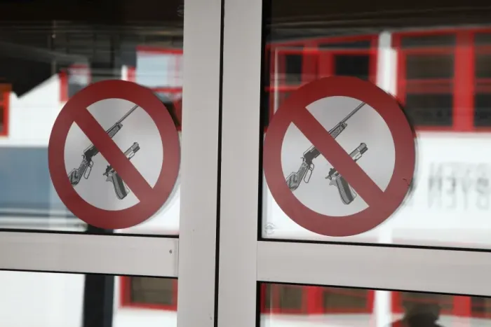 Framed Print : No firearms prohibitive sign for weapons at entrance to bank, worlds most northerly town, Longyearbyen, Spitsbergen